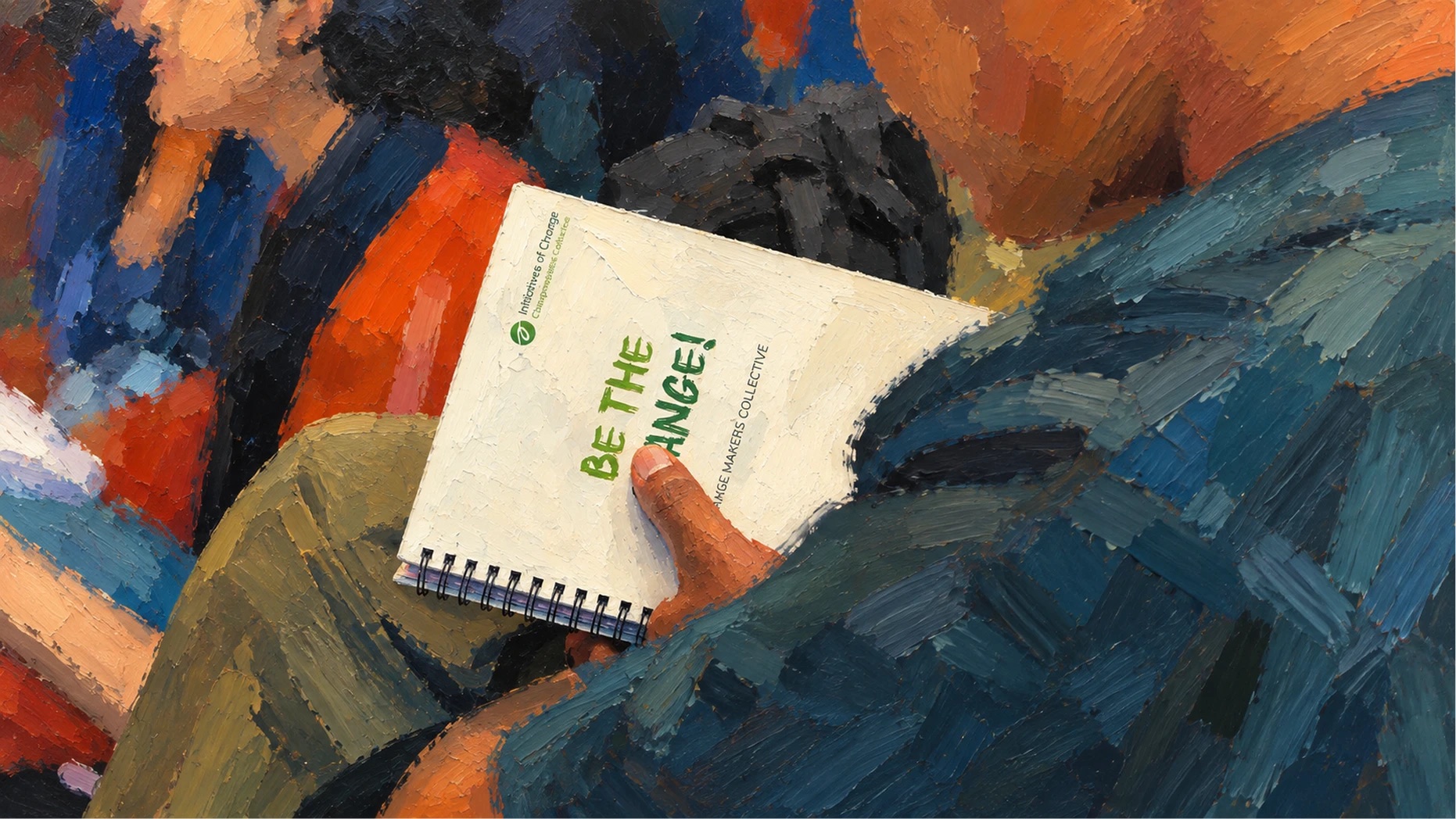 Painting of a hand holding a spiral notebook printed “Be the change!”.